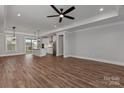 Open living area with hardwood floors, flowing into a bright kitchen and access to the backyard at 2063 Fordhill St, Rock Hill, SC 29732