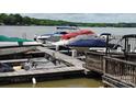 Dock with covered boats and jet skis, offering convenient access to lake activities at 221 Grayrock Dr, Statesville, NC 28677