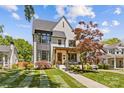 Charming two-story home featuring a manicured lawn and inviting front porch at 2509 Bay St, Charlotte, NC 28205