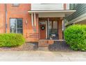 Inviting brick entryway with a wreath and well-manicured landscaping at 2988 Textile Way, Charlotte, NC 28205
