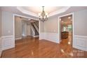 Dining area with hardwood flooring, elegant chandelier, and direct access to the kitchen at 427 Pinnacle Ln, Huntersville, NC 28078