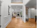 Grand foyer view showcasing hardwood floors, an open floor plan, and bright natural light, with high ceilings at 440 S Sharon Amity Rd, Charlotte, NC 28211