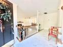 Bright foyer with marble flooring, staircase, and view into the living and dining areas at 944 Evian Ln, Matthews, NC 28015