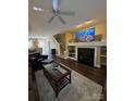 Comfortable living space with hardwood floors, fireplace, and open layout for a seamless flow at 1049 Park West Dr, Charlotte, NC 28209