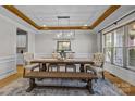 Elegant dining room with hardwood floors, wooden beams, and stylish decor at 10517 Sable Cap Rd, Mint Hill, NC 28227