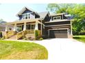 Beautiful craftsman-style home with a covered front porch, attached garage and a well-maintained lawn at 116 S Broad St, Waxhaw, NC 28173