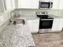 Granite countertops and stainless steel appliances accent this modern kitchen at 1252 Shenandoah Cir, Rock Hill, SC 29730
