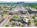 An aerial view of 130 Rail Crossing Lane surrounded by greenery and a city skyline at 130 Rail Crossing Ln # 101, Charlotte, NC 28209
