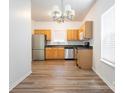 Functional kitchen with stainless steel appliances and light wood cabinets at 6212 Derryfield Dr, Charlotte, NC 28213