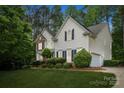 Lovely two-story home with brick and siding, complemented by mature landscaping and an attached garage at 109 Braxton Gate Ct, Mount Holly, NC 28120