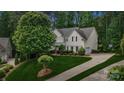 Charming two-story home with lush landscaping and a long driveway at 109 Braxton Gate Ct, Mount Holly, NC 28120