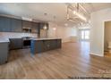 Modern kitchen with an island, recessed lighting, pendant lights, and stainless steel appliances at 11453 Prosperity Church Rd, Huntersville, NC 28078