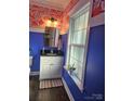 Charming bathroom with unique wallpaper, a decorative mirror, and a stylish vanity at 1200 Kent Dr, Lancaster, SC 29720