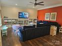 Spacious living room with built-in shelves, a media center, and comfortable seating for Gathering enjoyment at 1200 Kent Dr, Lancaster, SC 29720