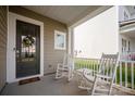 Inviting front porch with rocking chairs, perfect for relaxing and enjoying the neighborhood views at 13818 Jacks Ln, Pineville, NC 28134
