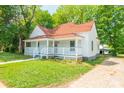 A charming home boasts a spacious yard, complemented by mature trees offering both shade and scenic beauty at 1712 S Main St, Salisbury, NC 28144