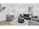 Cozy living room with modern furniture and an area rug, providing a comfortable gathering space at 1712 S Main St, Salisbury, NC 28144