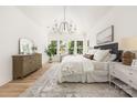 Airy bedroom with a vaulted ceiling, plush bedding, and an abundance of natural light at 1829 Union St, Charlotte, NC 28205