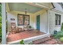 Charming front porch with brick flooring, rocking chairs, and a cozy welcome at 2015 Club Rd, Charlotte, NC 28205
