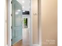 Charming foyer with a light blue door, unit 101, and bright natural light illuminating the hallway at 2338 Yadkin Ave # 101, Charlotte, NC 28205