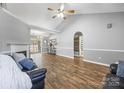 Bright living room with vaulted ceilings, a cozy fireplace, hardwood floors, and an open layout at 311 Masters Dr, Rock Hill, SC 29732