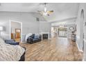 Spacious living room with vaulted ceilings, a fireplace, and seamless flow into the dining area and kitchen at 311 Masters Dr, Rock Hill, SC 29732