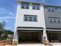 Spacious two-car garage showcasing modern design and ample storage space for vehicles and equipment at 416 Nathaniel Way # Brx0051, Charlotte, NC 28213