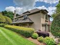Beautiful home with a two-car garage, landscaped lawn, and manicured hedges at 5603 Ballinard Ln, Charlotte, NC 28277