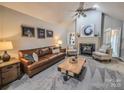 Inviting living room with a fireplace and vaulted ceilings, perfect for relaxing at 6231 Kentwood Dr, Kannapolis, NC 28081