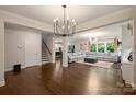 Spacious living room with hardwood floors, large sectional sofa, and lots of natural light at 6618 Vizcaya Ct, Charlotte, NC 28226
