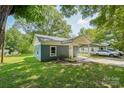 Another view of the front of the house with its covered porch and neat lawn at 814 Marve St, Gastonia, NC 28052