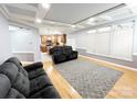 Inviting living room featuring hardwood floors, recessed lights, and coffered ceiling at 8218 Lynnewood Glen Dr, Charlotte, NC 28269