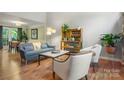 Bright living room with hardwood floors, stylish furnishings, and inviting decor at 9002 Maple Hill Ct, Huntersville, NC 28078