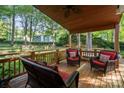 Relaxing covered porch with comfortable seating, perfect for enjoying the outdoor views at 9002 Maple Hill Ct, Huntersville, NC 28078