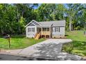 View of the home's front, showing the lawn, driveway, and mailbox of this charming property at 951 Hardin Dr, Shelby, NC 28150