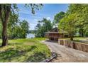 Spacious log cabin with a covered porch and a basement garage at 993 Jackson Rd, Fort Lawn, SC 29714