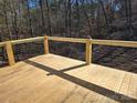 Spacious wood deck with stylish cable railing, perfect for outdoor enjoyment at 107 Skyland Dr, Mount Gilead, NC 27306