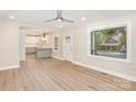 Bright and airy living room with an open layout leading into the updated kitchen at 1208 Fordham Rd, Charlotte, NC 28208