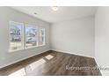 Bright bedroom with large windows and hardwood flooring, offering ample natural light at 1359 Russell St, Rock Hill, SC 29730