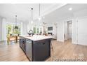 Open kitchen featuring a large island with seating, stainless steel appliances, and lots of light at 1359 Russell St, Rock Hill, SC 29730