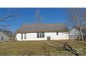 A view of the back of the house shows a large yard, fencing, and sliding glass doors at 1367 Springview Ct, Rock Hill, SC 29732