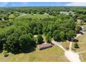 Expansive aerial view of property showing wooded acreage and secluded setting at 145 Mccreek Dr, China Grove, NC 28023