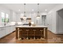 Gourmet kitchen featuring a large island, pendant lighting, and modern stainless steel appliances at 1816 Parson St, Charlotte, NC 28205