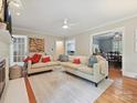 Bright living room with hardwood floors, cozy seating, and an open layout at 3128 Country Club Dr, Charlotte, NC 28205