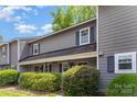 Two-story townhouse featuring a cozy front porch at 3131 Heathstead Pl, Charlotte, NC 28210