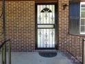 Inviting front door with decorative ironwork and a brick surround at 556 Roundtree Cir, Chester, SC 29706