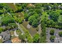 Aerial view showcases the community's lush landscaping, water features, and amenities at 5915 Mammoth Rd, Charlotte, NC 28270