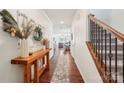 Inviting foyer featuring dark hardwood floors, a decorative console table, and an open view to the living areas at 6878 Spring Peeper Ln, Lancaster, SC 29720