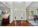 Bright foyer with hardwood floors, high ceilings, and a view of the front door and entry at 10223 Willingham Rd, Huntersville, NC 28078