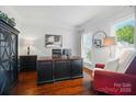 Comfortable home office featuring hardwood floors, natural light, and tasteful decor at 10223 Willingham Rd, Huntersville, NC 28078